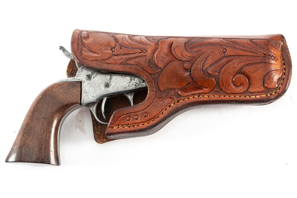 Nicely tooled Holster for a 4 1/2" revolver, marked "S.D. Myres, El Paso, Tex.", very good: Nicely tooled Holster for a 4 1/2" revolver, marked "S.D. Myres, El Paso, Tex.", very good condition. Holster is accompanied by a Hollywood style Prop Revolver. WILL BE SOLD AS ONE LOT. THE LATE DON P