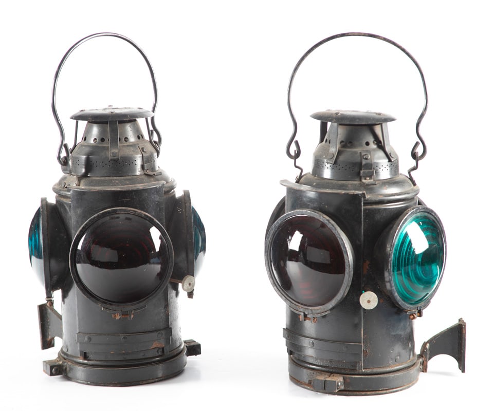 A pair of vintage Railroad Signal Lanterns marked "TIA", "Made By Noem", with both amber & blue: A pair of vintage Railroad Signal Lanterns marked "TIA", "Made By Noem", with both amber & blue lens, measure 14 1/2" T x 9 1/2" across, appear to be in original paint and are complete with iron handl