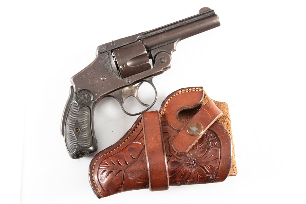 Smith & Wesson Safety Revolver, .38 caliber, SN 187925, dark brown aged patina, 3 1/4" barrel,: Smith & Wesson Safety Revolver, .38 caliber, SN 187925, dark brown aged patina, 3 1/4" barrel, stamped on right side of frame "USX", original grips, mechanically sound. Sold in a small single loop, fl