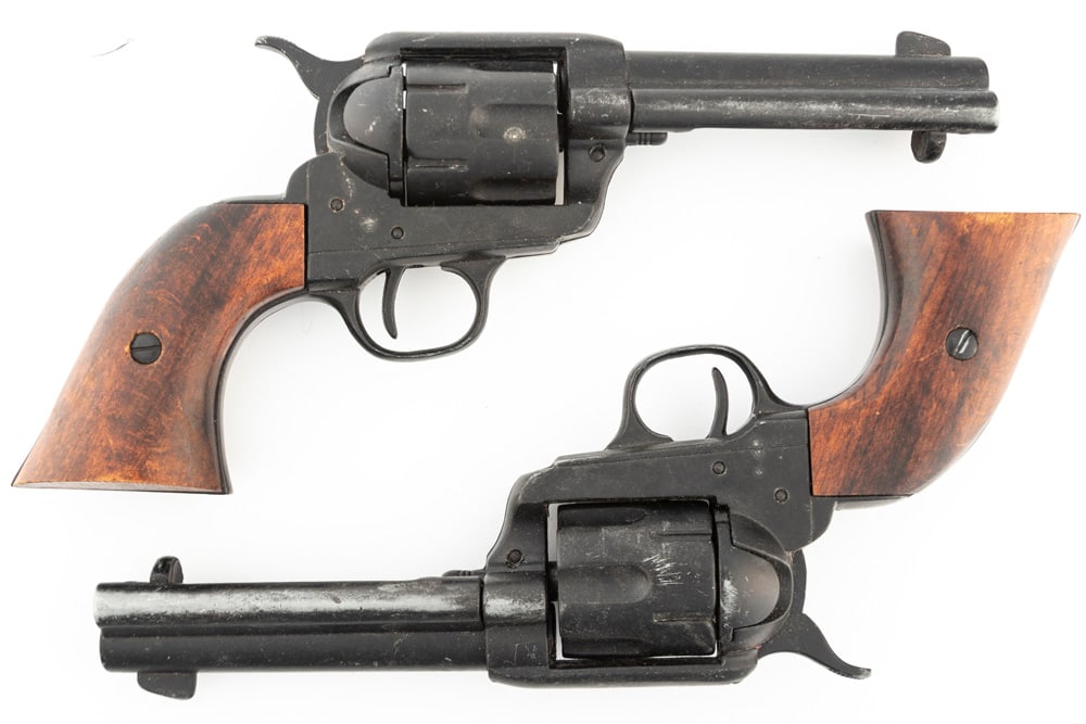 This lot consists of two Hollywood Style Prop Gun Revolvers. They are fashioned after Colt SA: This lot consists of two Hollywood Style Prop Gun Revolvers. They are fashioned after Colt SA Revolvers with 4 3/4" barrels. These two non-firing Prop Guns WILL SELL AS ONE LOT. THE LATE DON PERRY EST
