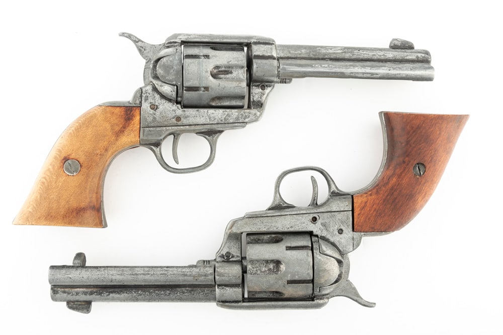 This lot consists of two Hollywood Style Prop Gun Revolvers. They are fashioned after Colt SA: This lot consists of two Hollywood Style Prop Gun Revolvers. They are fashioned after Colt SA Revolvers with 4 3/4" barrels. These two non-firing Prop Guns WILL SELL AS ONE LOT. THE LATE DON PERRY EST