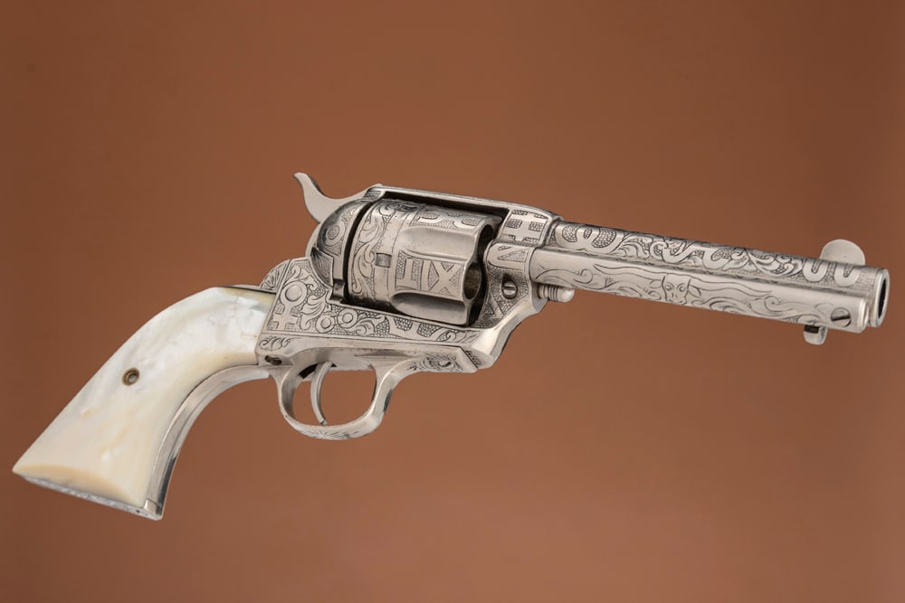 .THE FOLLOWING TWO LOTS ARE A MATCHED PAIR OF COLT SINGLE ACTION ARMY REVOLVERS ENGRAVED BY TEXAS