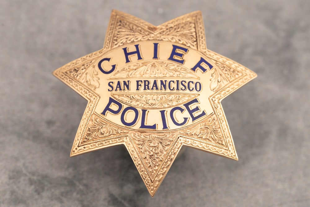Ornate vintage 14 Kt. gold Presentation 7-point Star Badge. Beautifully fully engraved and marked: Ornate vintage 14 Kt. gold Presentation 7-point Star Badge. Beautifully fully engraved and marked "Chief /San Francisco /Police". Marked on back "Presented to Charles W. Dullea by his friends and coll