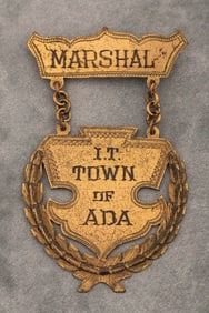Vintage Suspension Badge marked "Marshal/ I.T./ Town of Ada", beautiful design with date scratched
