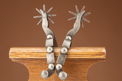 Pair of Eduardo Grijalva Spurs marked "EG" with star, silver mounted engraved with gal-legs.