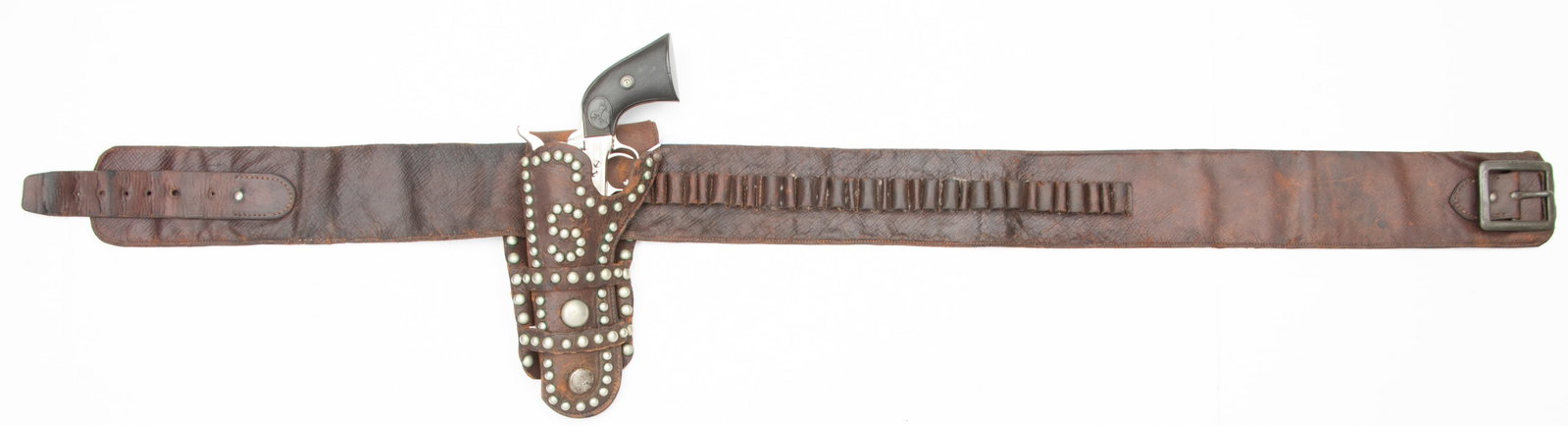 Vintage Spotted Holster and Money Belt. The holster is a double loop, left handed holster with no: Vintage Spotted Holster and Money Belt. The holster is a double loop, left handed holster with no markings that fits a 4 3/4” Colt SAA. There is a mixture of 58 large and small spots on the pock