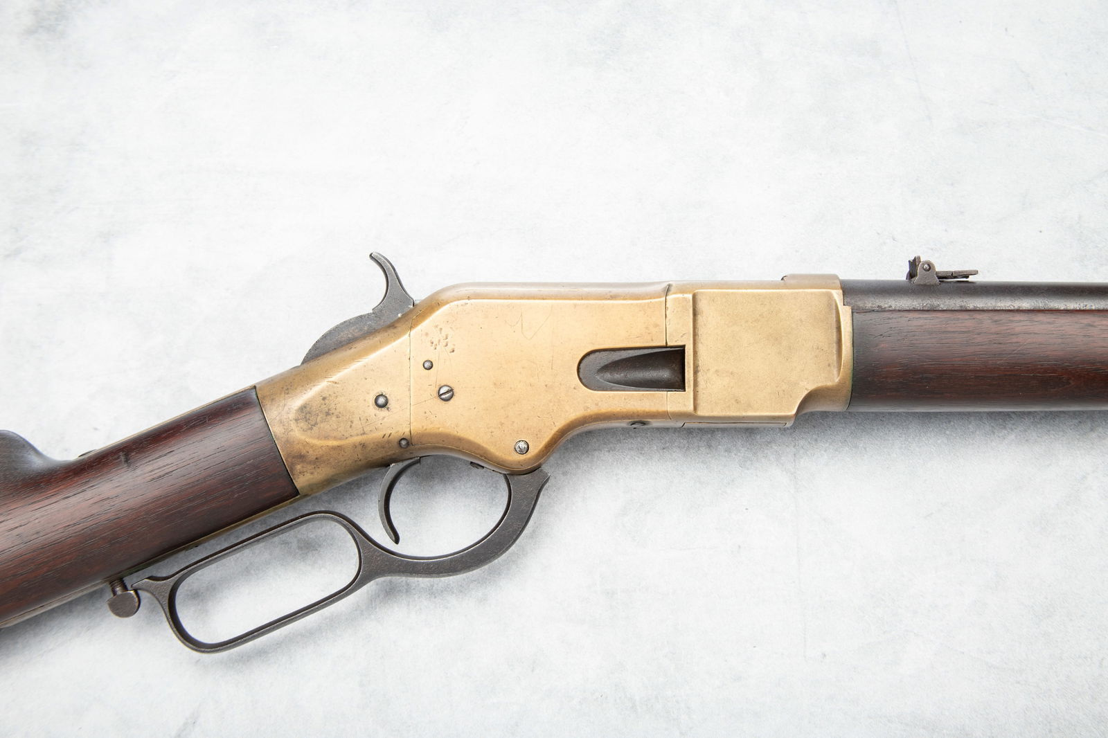 Antique Winchester, Model 1866 Saddle Ring Carbine, SN 164479, manufactured circa 1886. This is a: Antique Winchester, Model 1866 Saddle Ring Carbine, SN 164479, manufactured circa 1886. This is a standard, saddle ring carbine with a 20” round barrel, full length magazine tube and a carbine b