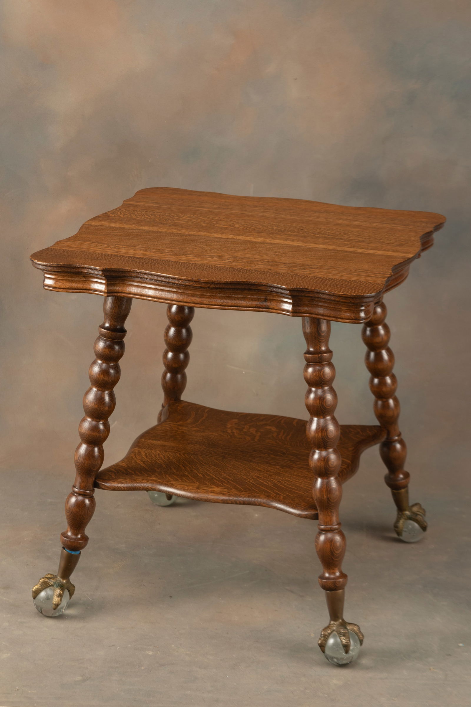 Fancy antique quarter sawn oak, oversized ball & claw Lamp Table, circa 1900-1910, with tiffany type: Fancy antique quarter sawn oak, oversized ball & claw Lamp Table, circa 1900-1910, with tiffany type glass ball & claw feet, measures 27 1/2" square top x 30" T. Extremely fine condition and finish.