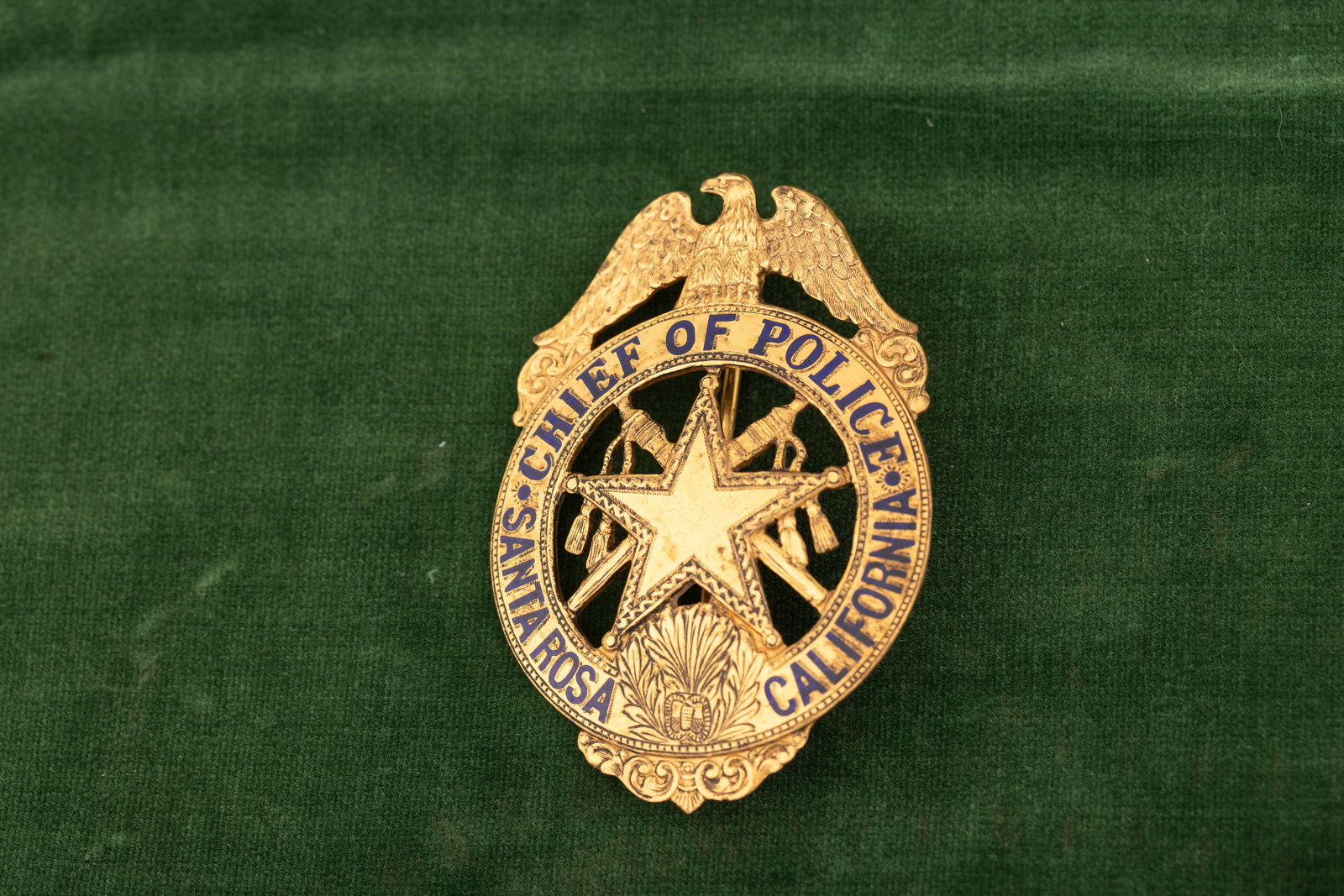 Large vintage Circle Star Badge with winged eagle crest marked "Chief of Police/Santa: Large vintage Circle Star Badge with winged eagle crest marked "Chief of Police/Santa Rosa/California", beautiful detail with crossed batons behind 5-point star. Hallmark by famed maker "Ed Jones/ Oak