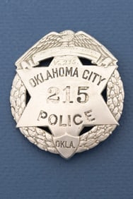 Vintage Circle Badge with eagle crest and wreath border with cut out 6-point star center "Oklahoma