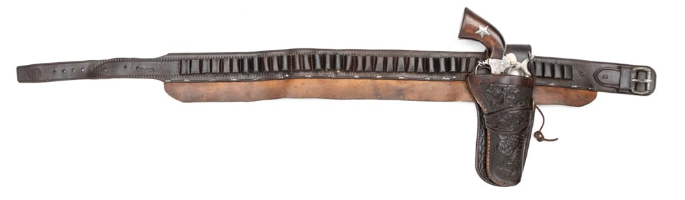 Vintage Cartridge Belt marked by scarce maker "J.H. Haney & Co., Omaha", looped foe a .45 caliber: Vintage Cartridge Belt marked by scarce maker "J.H. Haney & Co., Omaha", looped foe a .45 caliber cartridge, accompanied by a floral tooled single loop Holster, excellent condition with unusual leathe