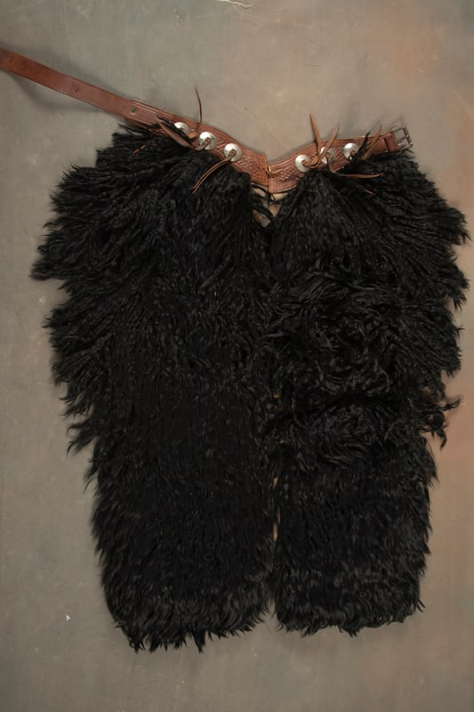 Extremely fine vintage pair of black Angora Wooly Chaps marked on billet "Blake Miller, Cheyenne,: Extremely fine vintage pair of black Angora Wooly Chaps marked on billet "Blake Miller, Cheyenne, Wyo.", basket weave leather belt and six conchos. Very fine condition with canvas lining, 42" belt. On