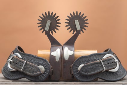 Pair of double mounter Spurs marked "Dill" with engraved sombreros on one side and engraved silver