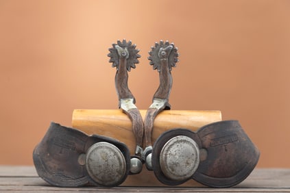 Pair of early double gal-leg single mounted Spurs, attributed to McChesney, shows to have had the