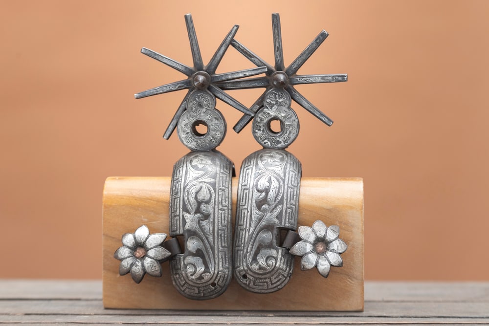 Pair of vintage double mounted heavy iron Chihuahua Spurs with multi-point silver inlaid 3" rowels,: Pair of vintage double mounted heavy iron Chihuahua Spurs with multi-point silver inlaid 3" rowels, floral silver inlaid buttons. Outstanding workmanship! HUTCHESON COLLECTION.