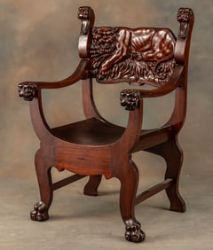 Antique highly carved mahogany bow bottom, fire side Arm Chair, circa 1900, with full carved lion in