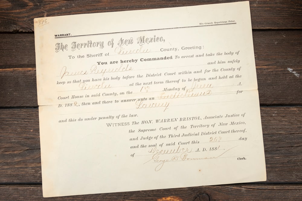 Historical signed on back "Pat Garrett, Sheriff" and dated December 26, 1881: Historical signed on back "Pat Garrett, Sheriff" and dated December 26, 1881, Warrent for The return body of Jarvis Reynolds measures 7" x 8 1/2". Accompanied by a typed letter by the Earles pertainin