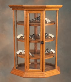 Very desirable octagon shaped, antique oak and glass revolving Showcase, circa 1880, excellent