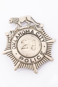 Fantastic vintage Sunburst shaped Badge with lion crest marked "Oklahoma City Police", with "29" in
