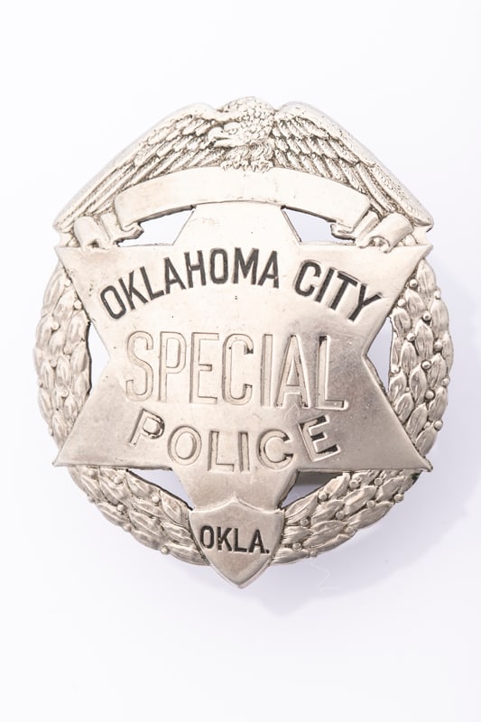 Vintage Circle Badge with eagle crest marked "Oklahoma City / Special Police / Okla." with 6-point: Vintage Circle Badge with eagle crest marked "Oklahoma City / Special Police / Okla." with 6-point cut out star center and wreath detailing on surround. Nice looking, no hallmark, the saddle pin is br