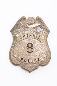 Large old Shield Badge with eagle crest marked "Guthrie / 8 / Police". Most of the plating is gone,