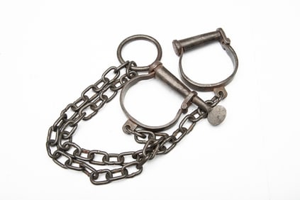 Early pair of Iron Leggings with double cuffs and large iron ring in center of chain, possibly used