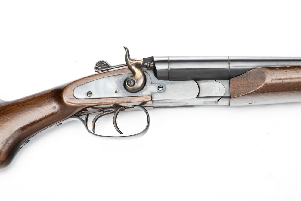 Rossi Double Barrel 12 ga. Shotgun in near pristine condition, SN T59316, blue finish, 20" barrels,: Rossi Double Barrel 12 ga. Shotgun in near pristine condition, SN T59316, blue finish, 20" barrels, marked on barrel flat " AMADEO ROSSI, Made In Brazil". High gloss wood. (MODERN) EARLE ESTATE.