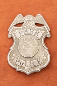Large vintage Shield Badge with eagle crest marked "Park Police / 23" with raised "City and County