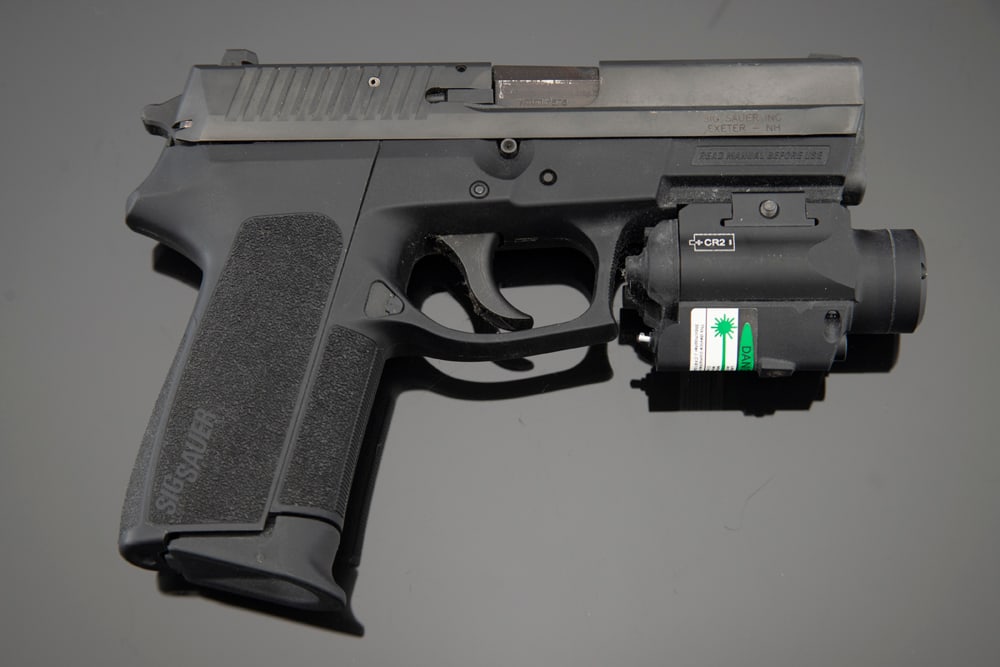 Factory Boxed Sig Sauer, Model SP2022, Semi-Auto Pistol, 9 mm, SN 24B131229, matte finish, 2 1/2": Factory Boxed Sig Sauer, Model SP2022, Semi-Auto Pistol, 9 mm, SN 24B131229, matte finish, 2 1/2" barrel, fitted with a 2HY02G Laser Sight. Sold in original box with extra magazine, lock, extra grip c
