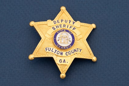 Vintage gold colored 6-point Ball Star Badge marked "Deputy Sheriff / Fulton County Ga." with "State