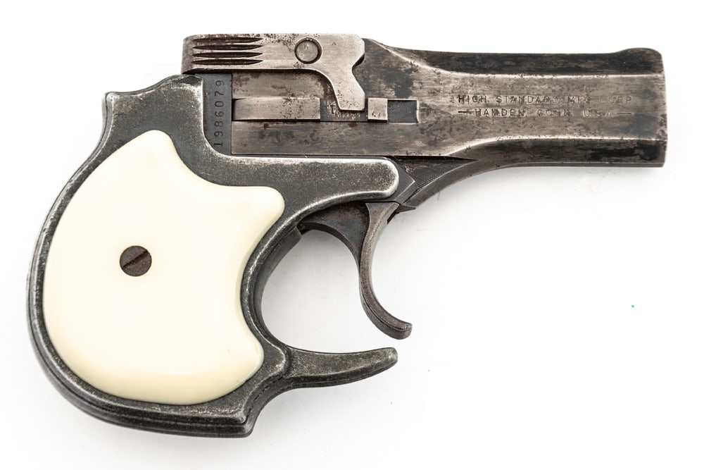 Very desirable High Standard, Model DM 101, OU Derringer, .22 Mag caliber, SN 1986079, blue finish,: Very desirable High Standard, Model DM 101, OU Derringer, .22 Mag caliber, SN 1986079, blue finish, shows much thinning on frame and barrel, 3 1/2" barrel, original white plastic grips. mechanically s