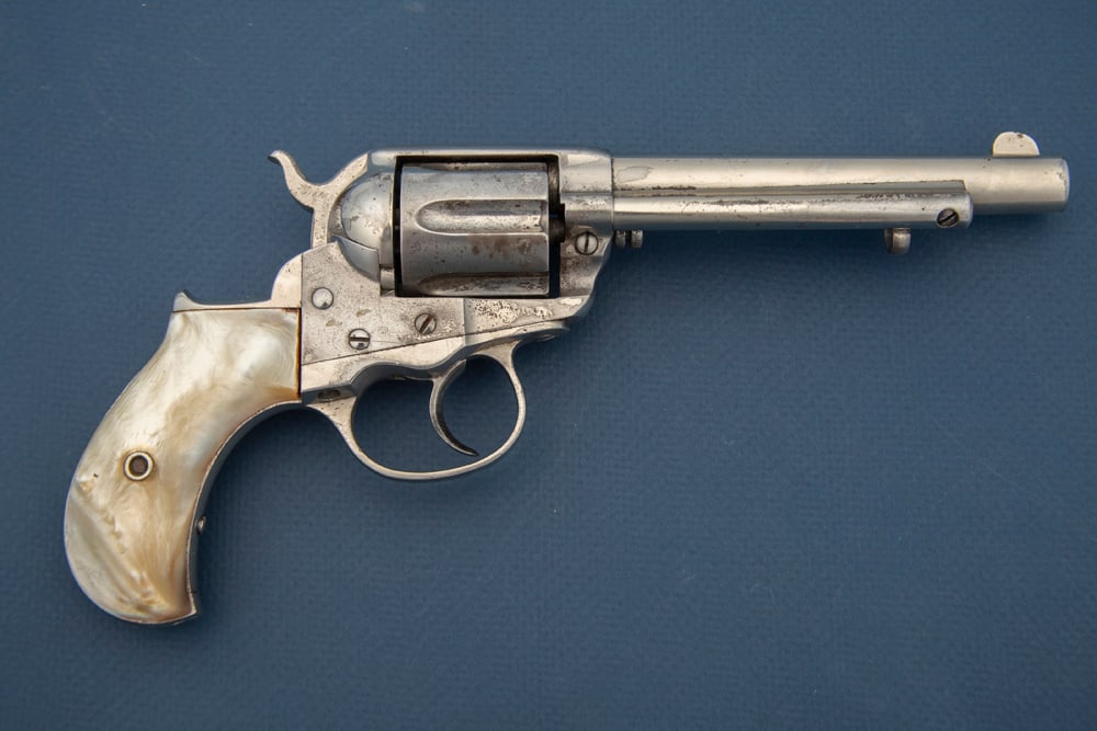 Antique Colt, 1877, SN 83618, Thunderer Storekeeper’s Model, Pearl Stocks. Colt, Model1877, .41: Antique Colt, 1877, SN 83618, Thunderer Storekeeper’s Model, Pearl Stocks. Colt, Model1877, .41 caliber, 6-shot Revolver with a scarce 5” barrel, manufactured circa 1891. Serial numbermatches 