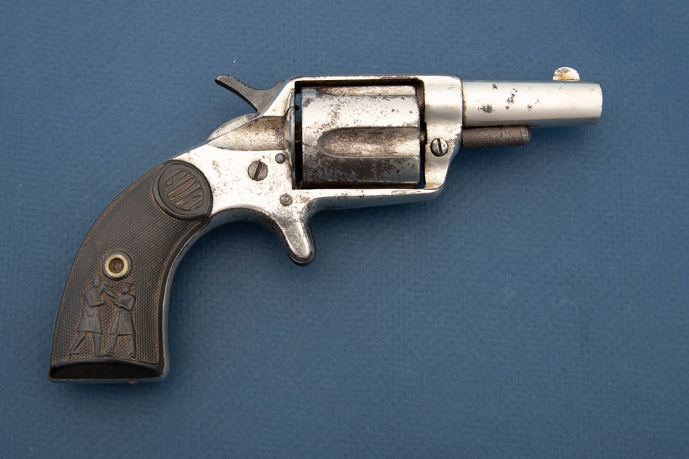 Antique Colt, New Police, SN 21380, aka Cop & Thug. Manufactured circa 1882-1886 in a: Antique Colt, New Police, SN 21380, aka Cop & Thug. Manufactured circa 1882-1886 in a totalproduction of approximately 4000. This is a .38 caliber center fire, 5-shot Revolver with a 2 1/4”barre