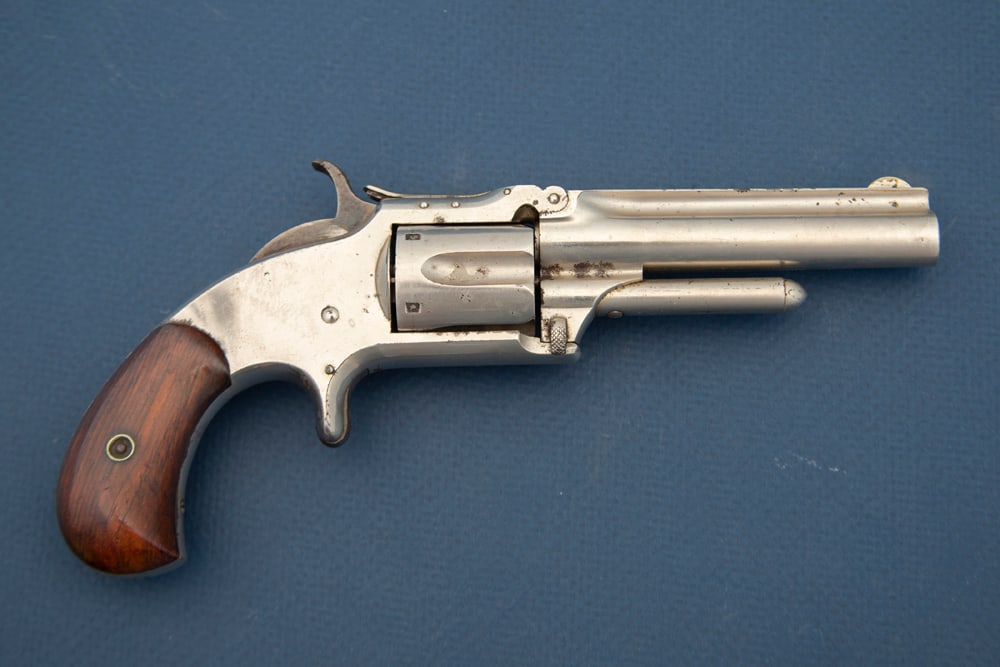 Antique Smith & Wesson, Model 1 1/2, SN 81046. Manufactured circa 1868-1875, This is a .32caliber: Antique Smith & Wesson, Model 1 1/2, SN 81046. Manufactured circa 1868-1875, This is a .32caliber rimfire, 5-shot Revolver with a 3 1/2” barrel, nickel finish and rosewood stocks. It has avery h
