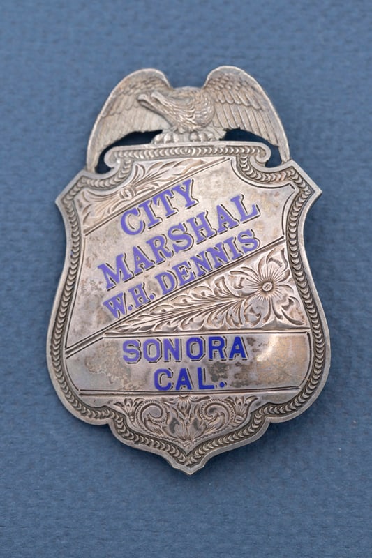 Vintage Sterling Silver Shield Badge with eagle crest, marked "City Marshal W.H. Dennis / Sonora: Vintage Sterling Silver Shield Badge with eagle crest, marked "City Marshal W.H. Dennis / Sonora Cal.", the lettering is in hard blue enamel and beautifully engraved. Back is hallmarked "Irmine & Jach
