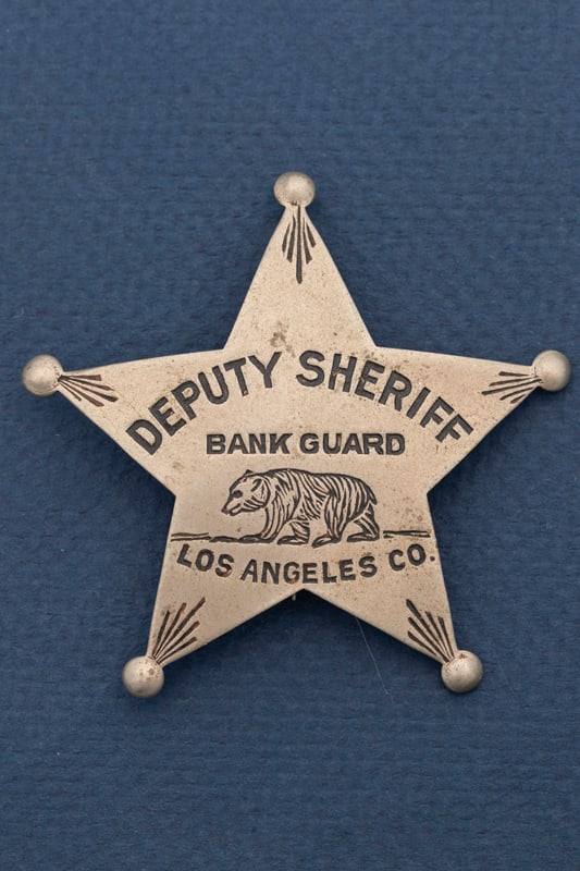 Five-point Ball Star Badge marked "Deputy Sheriff / Bank Guard / Los Angeles Co." with a bear: Five-point Ball Star Badge marked "Deputy Sheriff / Bank Guard / Los Angeles Co." with a bear engraved in center under the words Bank Guard, measures 2 3/4" T x 2 3/4" W with pin and tongue catch. Est