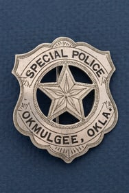 Vintage Shield Badge with 5-point cut out star center marked "Special Police / Okmulgee, Okla.",