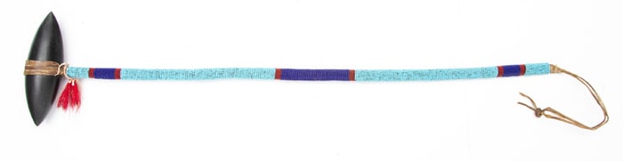 Beautiful fully beaded War Club with double pointed head. NOTE: Rawhide wrapped. Beads indicate