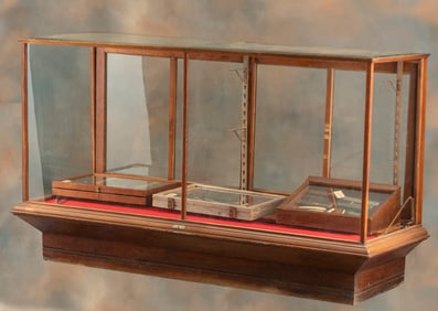 Antique oak, 6 ft. floor model, sliding glass door Showcase with original label marked "Kansas City