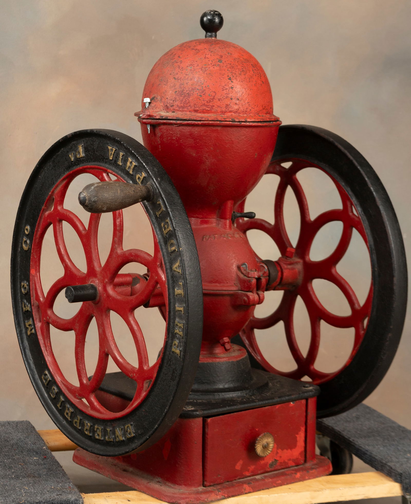 Large Country Store cast iron Coffee Mill marked "Enterprise Mfg./ Philadelphia, PA./ Pat'd October: Large Country Store cast iron Coffee Mill marked "Enterprise Mfg./ Philadelphia, PA./ Pat'd October 21, 1873", 19 1/2" wheels, 30" tall to top of hopper, on 13" square cast iron base. Original metal d