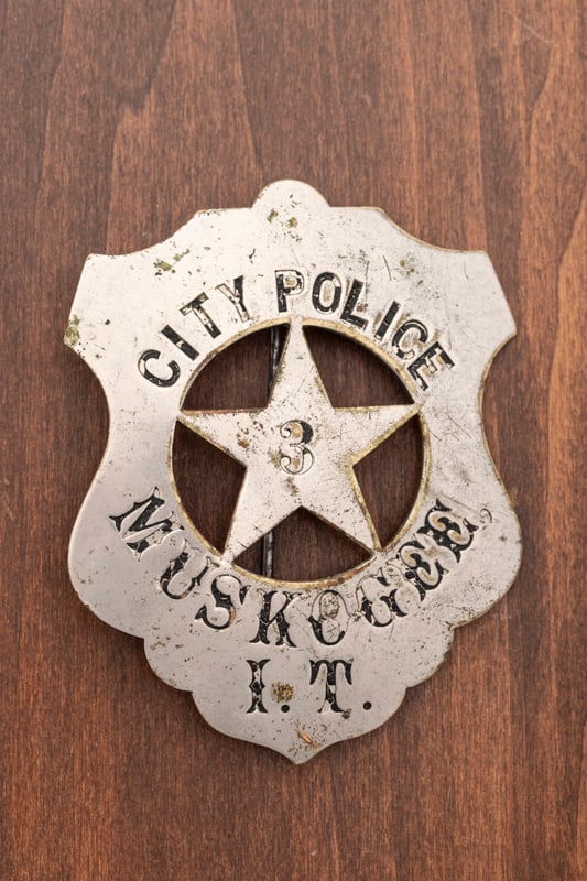 Very old Shield Badge with cut out 5-point star center marked "City Police Muskogee I.T. (Indian: Very old Shield Badge with cut out 5-point star center marked "City Police Muskogee I.T. (Indian Territory)", with a "3" in center of star. Pin is broken with replaced tongue, measures 2 7/8" T x 2 1/