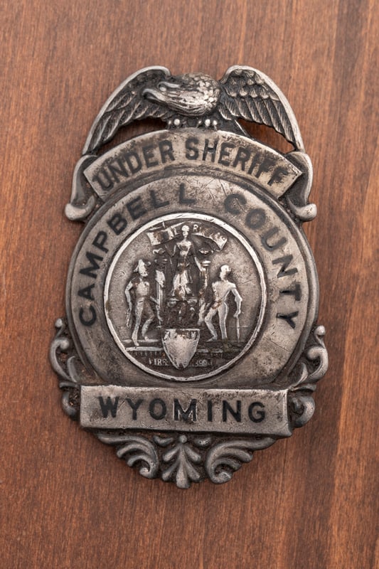 Vintage Sterling Silver Shield Badge with winged eagle crest marked "Under Sheriff / Campbell County: Vintage Sterling Silver Shield Badge with winged eagle crest marked "Under Sheriff / Campbell County / Wyoming". Back is hallmarked "C.D. Reese / 57 Warren St. / N.Y." and is stamped "Sterling". Has p
