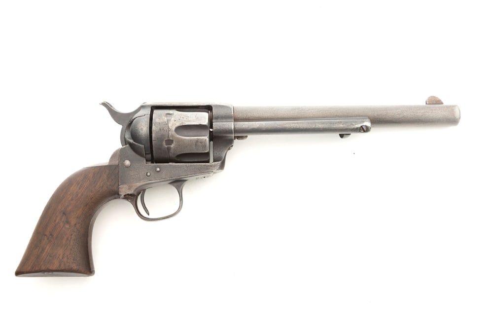 Antique Colt SAA Revolver, .45 caliber, SN 104196, manufactured 1883, blue finish, 7 1/2" barrel: Antique Colt SAA Revolver, .45 caliber, SN 104196, manufactured 1883, blue finish, 7 1/2" barrel with one line barrel address, retains some blue in protected areas with balance being smooth gray patin