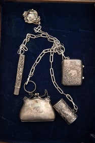 Victorian era Chatelaine with four chain drops that hold a silver Match Holder, silver Pill Box,