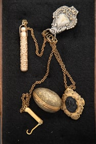 Early Chatelaine in gold filled finish with four suspended chains with ornate gold color Striker,