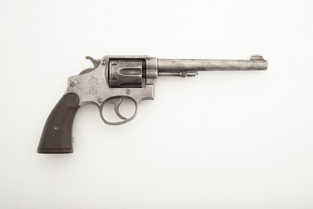 Pre-War Smith & Wesson Hand Ejector Pin Frame Revolver, .32 Win caliber, SN 32879, no remaining: Pre-War Smith & Wesson Hand Ejector Pin Frame Revolver, .32 Win caliber, SN 32879, no remaining finish, gray aged patina, checkered walnut grips showing much wear, 6 1/2" barrel. (MODERN)