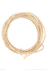 Hand braided rawhide Reata, approximately 28 ft. long with braided rawhide hondo. EARLE ESTATE.