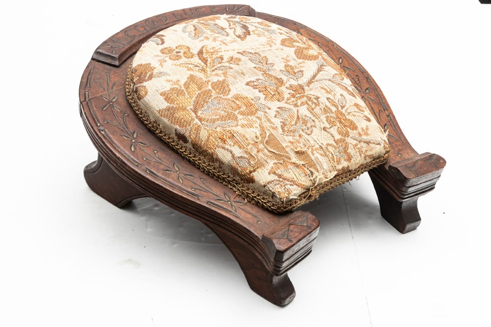 Antique solid walnut carved horseshoe Footstool in original finish, circa 1900, with the words "Good: Antique solid walnut carved horseshoe Footstool in original finish, circa 1900, with the words "Good Luck" carved at top of horseshoe.