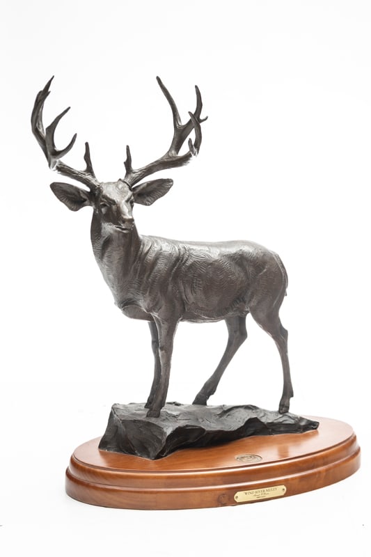 Bronze Sculpture by artist Jeroll O'Bryon, titled "Wind River Muley" and numbered. Bronze sits on a: Bronze Sculpture by artist Jeroll O'Bryon, titled "Wind River Muley" and numbered. Bronze sits on a 15 1/2" oval wooden base. Deer stands 20" T. Great detail, a real giant. Base has inlaid brass medal