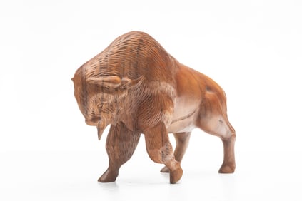 Hand carved American Buffalo, appears to be carved from one solid piece of wood, 10 1/2" T x 14" L.